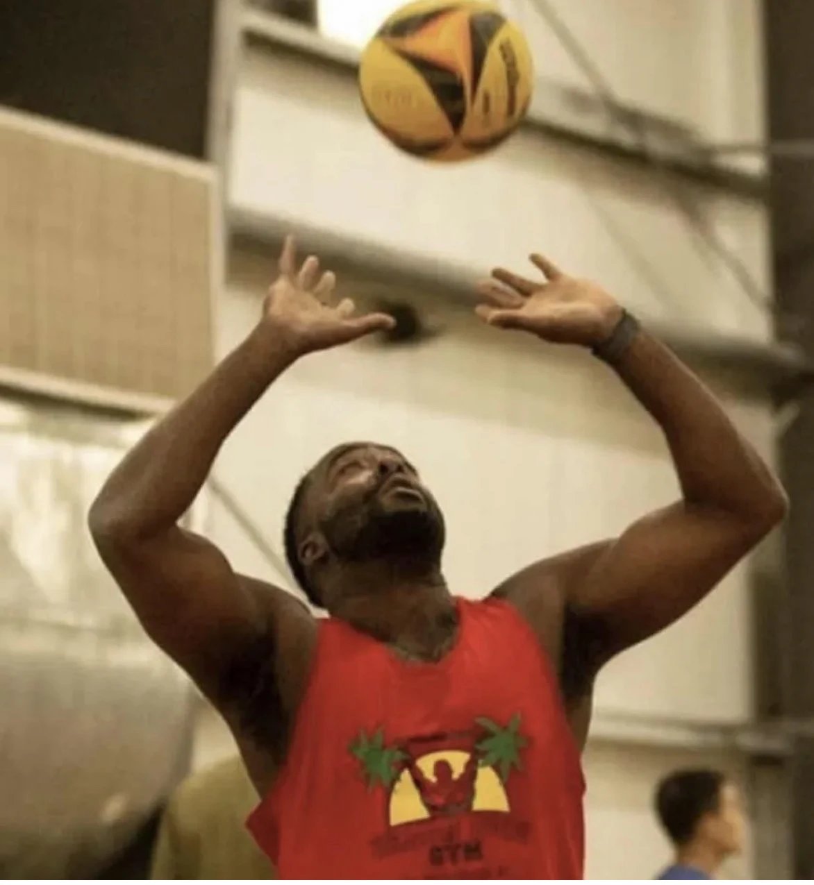 Ray Bell, Gametime Hero sports app developer in red shirt shooting basketball