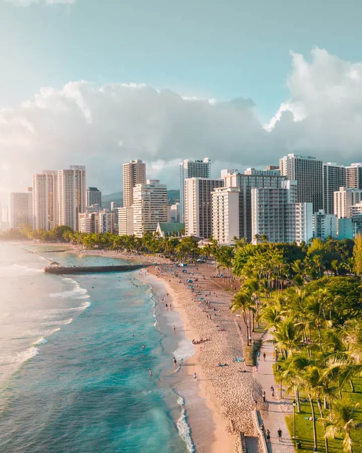 Aerial scene of hawaii beach with cityscape background