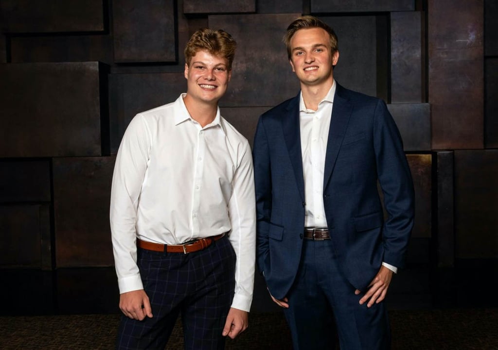Huck and Wyatt, Refr Sports referee management app founders, posing together in business clothes
