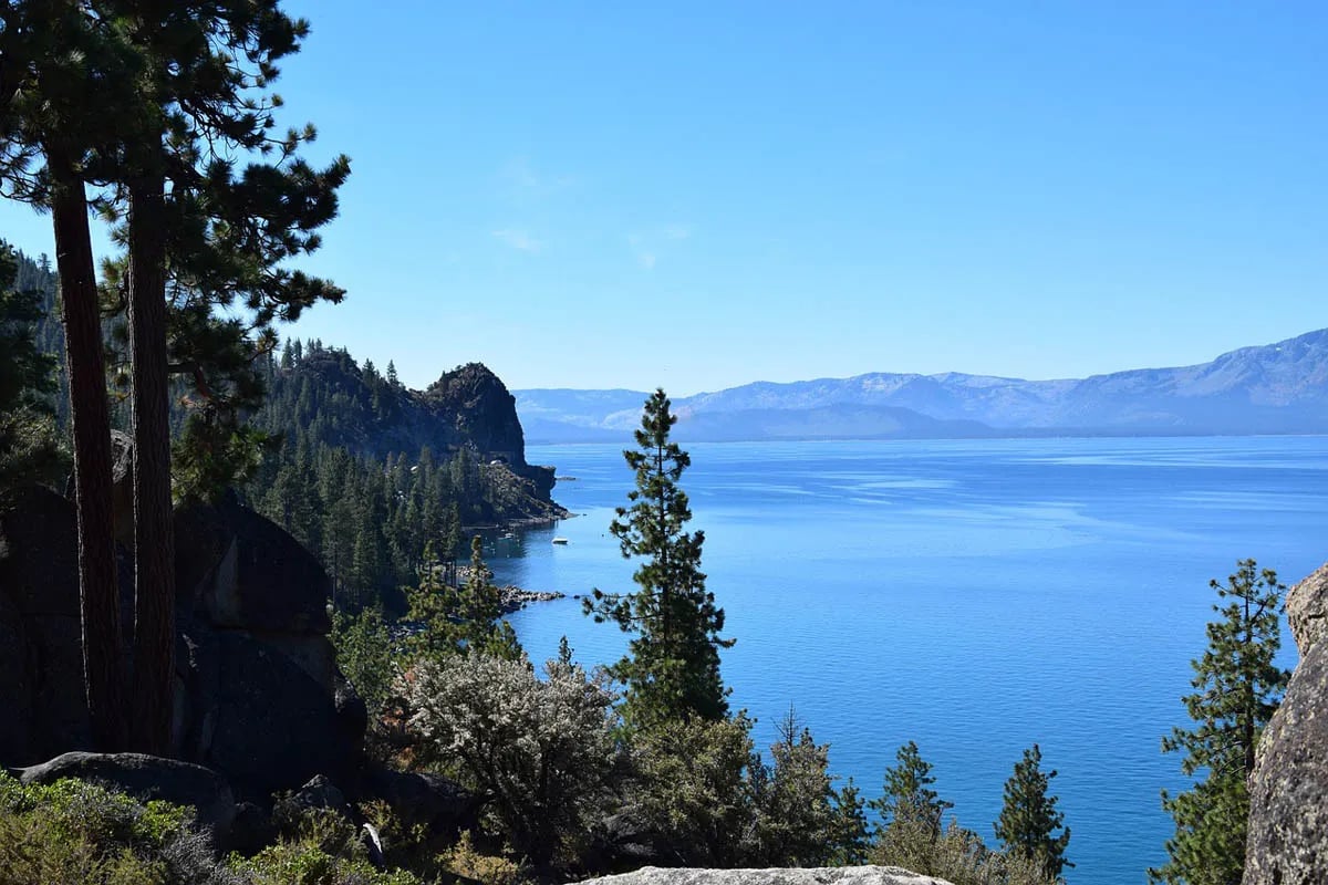 Scenic view of Lake Tahoe with lake, mountains and trees in foreground