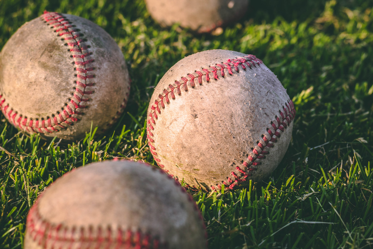 1200x900 closeup baseballs on grass
